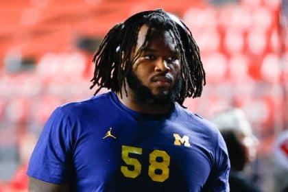 Michigan DL Smith pleads guilty to lesser charge