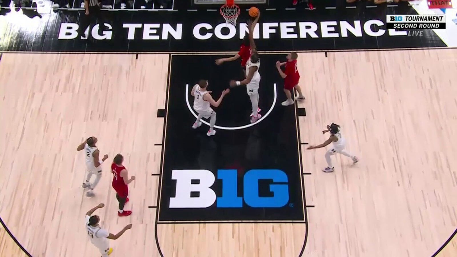 Rutgers' Derek Simpson grabs his own rebound for a bucket