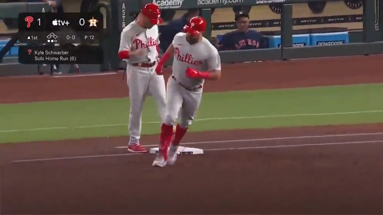 Phillies' Kyle Schwarber drives a solo home run deep to right against the Astros