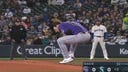 Rockies pitcher Noah Davis dodges a comebacker by a hair - with the ball just barely dislodging his hat