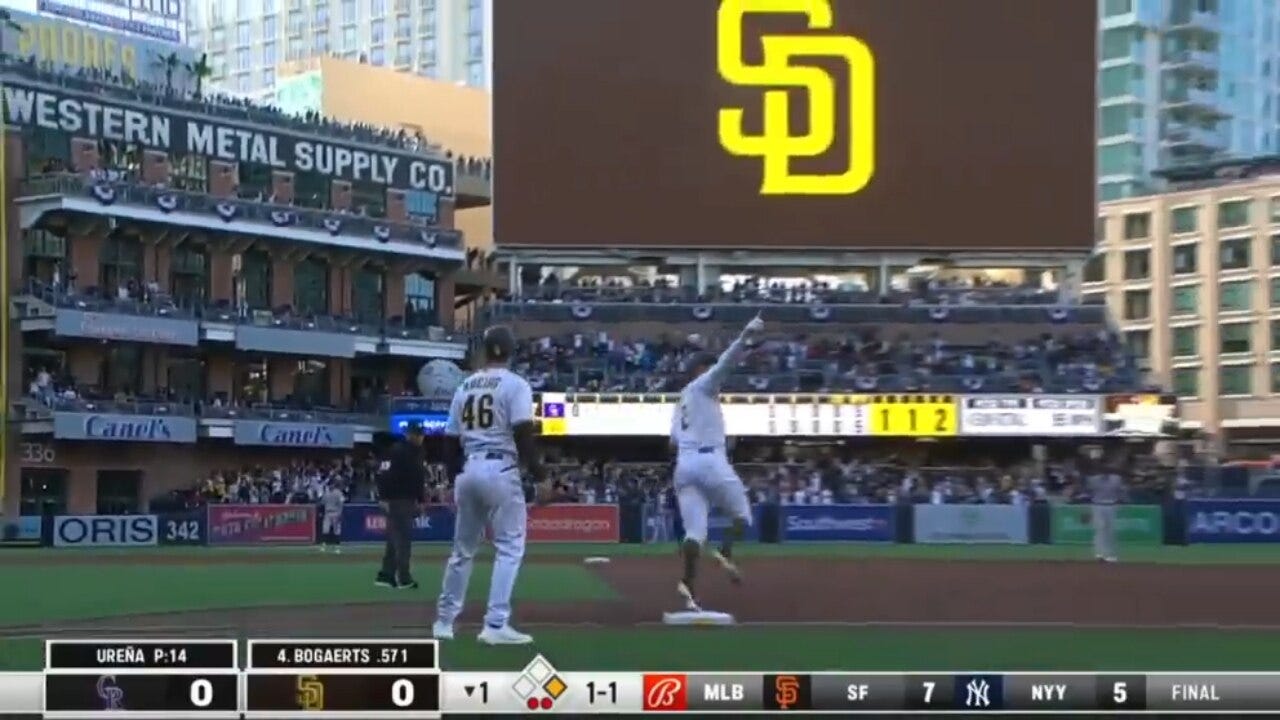 Xander Bogaerts smashes his first home run as a Padre to left-center field against the Rockies