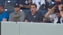 A squirrel makes a surprise visit at Yankee Stadium and hilariously startles some New York fans