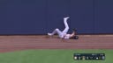 Astros' Jake Meyers crashes into the wall to make the catch and closes out the inning against the Brewers