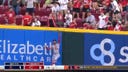 Reds' Matt McLain hits a solo homer after fly ball hits the outfielder's mitt and into the stands