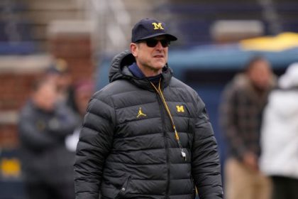 Harbaugh cites vetting error in Schembechler hire