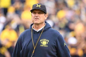 Source: Michigan's Harbaugh facing 4-game ban