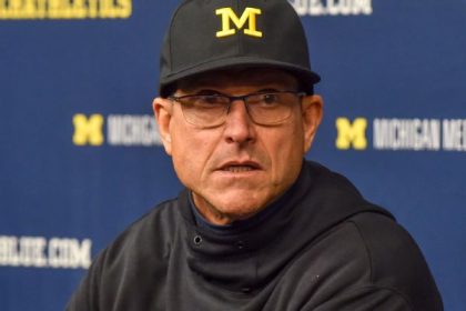 Harbaugh slams 'status quo,' wants players paid