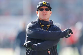 Michigan self-imposes 3-game ban for Harbaugh