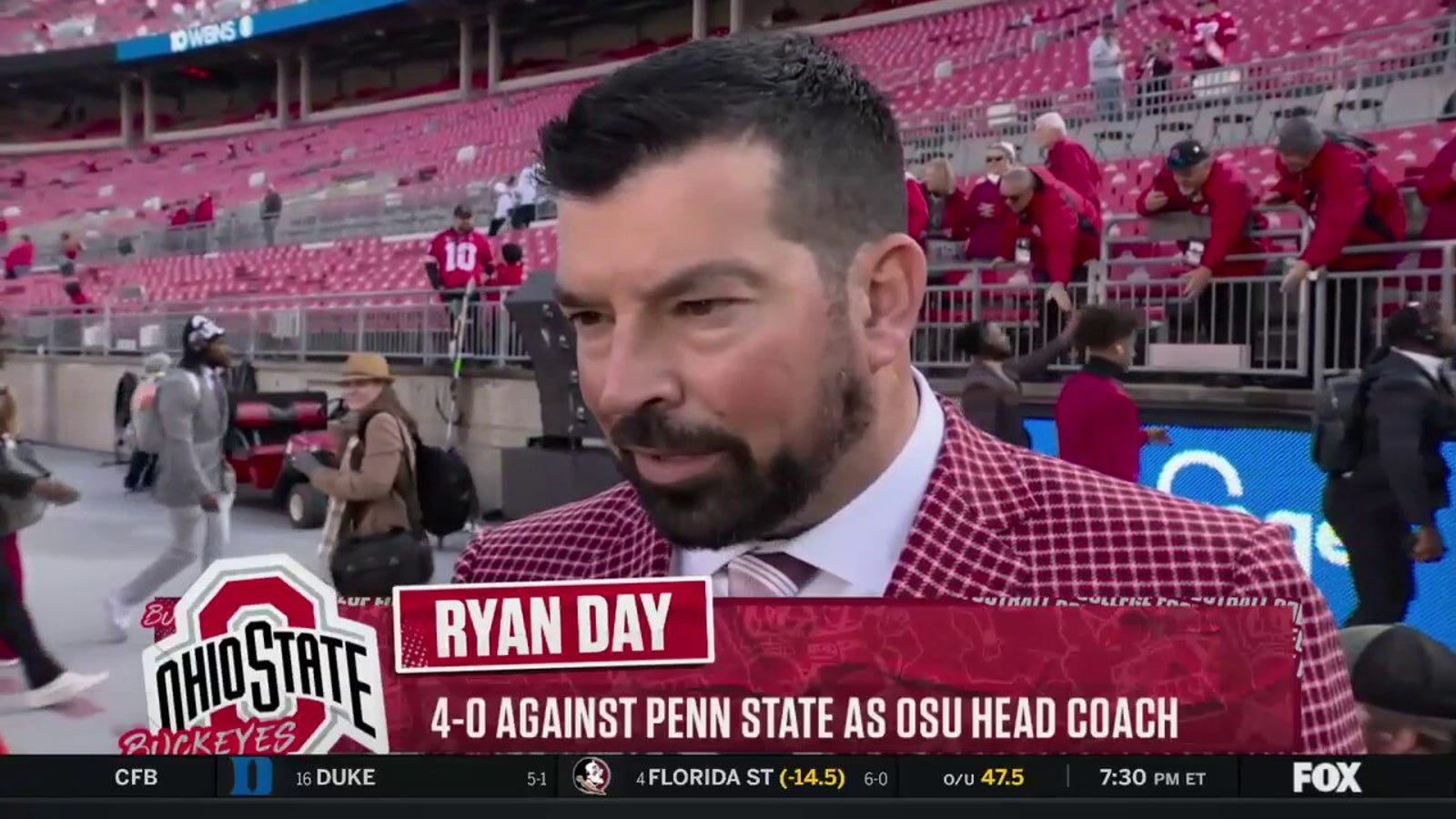 Ohio State coach Ryan Day talks with Jenny Taft