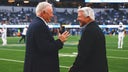 Jimmy Johnson embraces Jerry Jones, Michael Irvin during Cowboys' win over Chargers