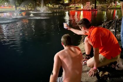 The late-night dive to rescue the Bedlam goalposts after Oklahoma State's historic win