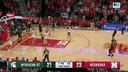 Carson Cooper throws down a strong two-handed dunk to help Michigan State tie the game against Nebraska