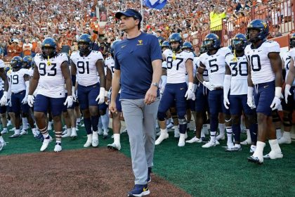 West Virginia coach allowed to build on 8-4 year