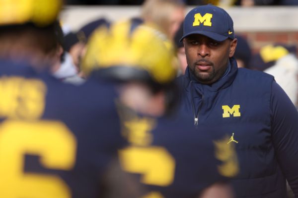 Michigan hires Moore as coach on 5-year deal