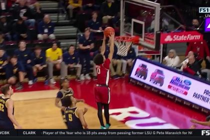 Derek Simpson throws down a vicious two-handed slam to extend Rutgers' lead over Michigan