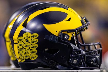 U-M gets probation, fine for recruiting violations