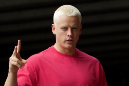 Joe Burrow reports to training camp with new buzz haircut