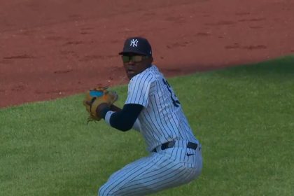 Yankees' Jazz Chisholm Jr. makes a great scoop to throw out the runner at first against the Rockies