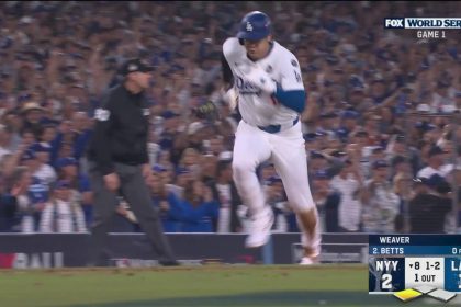 Dodgers' Shohei Ohtani scores on a sacrifice fly by Mookie Betts to tie the game vs. Yankees