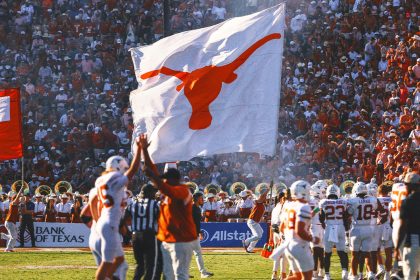 Texas players plant flag through Baker Mayfield Oklahoma jersey following win