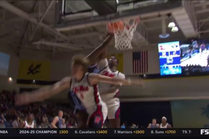 BYU's Fousseyni Traore posterizes two Ole Miss defenders with an authoritative slam