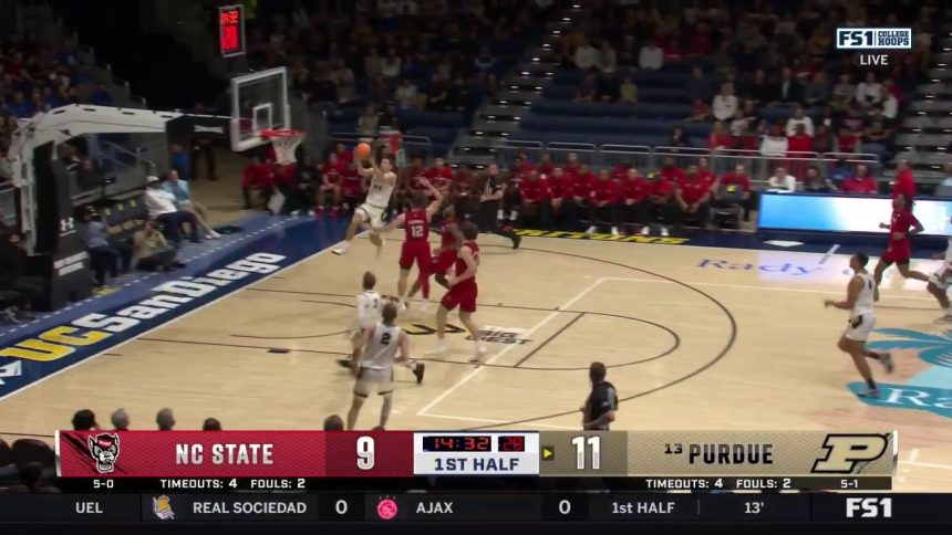 Camden Heide throws down the alley-oop in transition, extending Purdue's lead over NC State