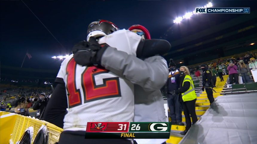 Tom Brady hugs his son after winning the 2021 NFC Championship