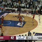 Juju Watkins blocks Paige Bueckers and lays it up on the other end, extending USC's lead vs. UConn