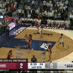 Juju Watkins drills a 3-pointer over Paige Bueckers, extending USC's lead over UConn