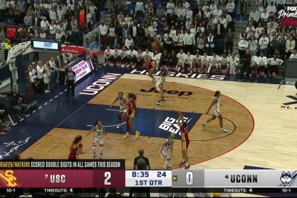 Juju Watkins drills a 3-pointer over Paige Bueckers, extending USC's lead over UConn