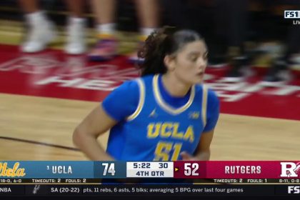 Lauren Betts muscles her way inside for the tough bucket, extending UCLA's lead over Rutgers