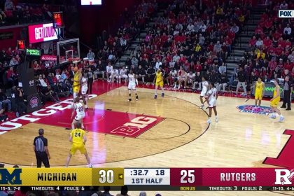 Vladislav Goldin hammers the one-handed jam, extending Michigan's lead over Rutgers